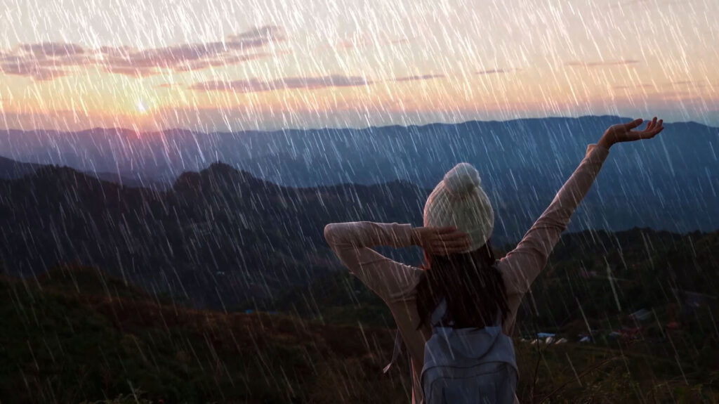Layering multiple rain overlay clips in Premiere Pro to add depth to the rainfall effect